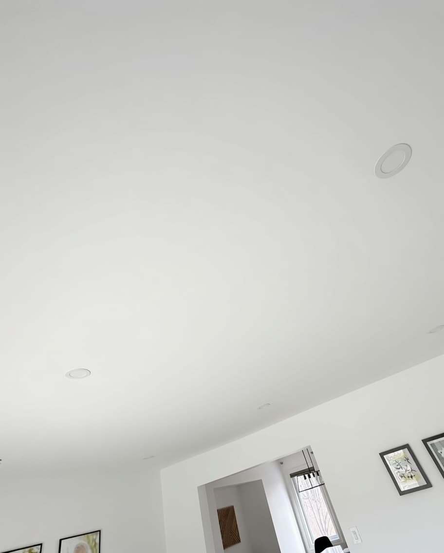 Smooth painted ceiling after popcorn removal in a Fremont home